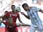 Iran's defender Jalal Hosseini and Argentina's forward Sergio Aguero vie for the ball during the Group F football match between Argentina and Iran at the Mineirao Stadium in Belo Horizonte during the 2014 FIFA World Cup in Brazil on June 21, 201
