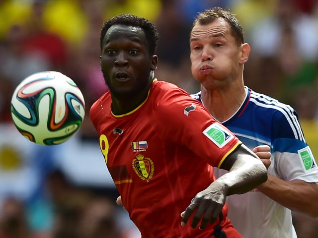Russia's defender and captain Sergey Ignashevich watches Belgium's forward Romelu Lukaku control the ball during the Group H football match between Belgium and Russia at The Maracana Stadium in Rio de Janeiro on June 22, 2014