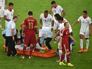 Chile's midfielder Jose Pedro Fuenzalida is taken off the pitch in a stretcher during a Group B football match between Spain and Chile in the Maracana Stadium in Rio de Janeiro during the 2014 FIFA World Cup on June 18, 2014