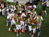 Costa Rica players celebrate after Bryan Ruiz scored their team's first goal during the 2014 FIFA World Cup Brazil Group D match against Italy on June, 20, 2014