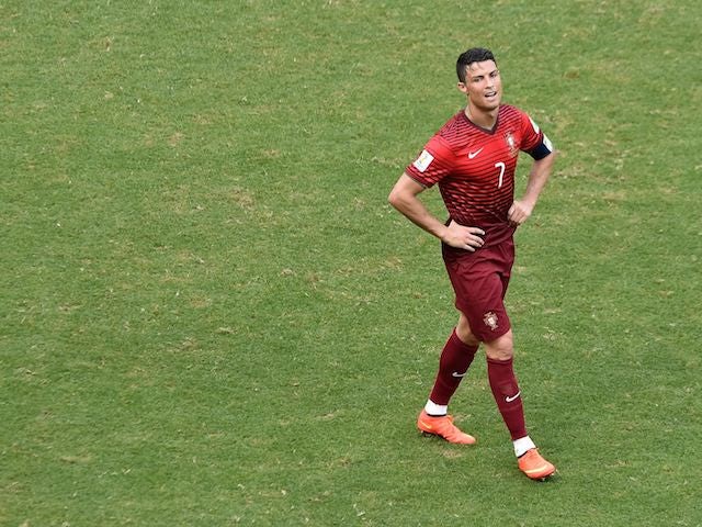 A dejected Cristiano Ronaldo walks away after Portugal lose 4-0 to Germany in their World Cup opener on June 16, 2014.