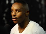 Devon Alexander talks with reporters during a training session in preparation for his upcoming fight against Shawn Porter at Gleason's Gym on December 3, 2013
