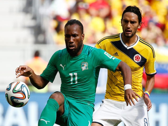 Didier Drogba (L) of the Ivory Coast vies with Abel Aguilar of Colombia during the 2014 FIFA World Cup Brazil Group C match on June 19, 2014