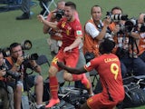 Belgium's midfielder Dries Mertens (L) celebrates after scoring his team's second goal during the Group H football match against Algeria on June 17, 2014