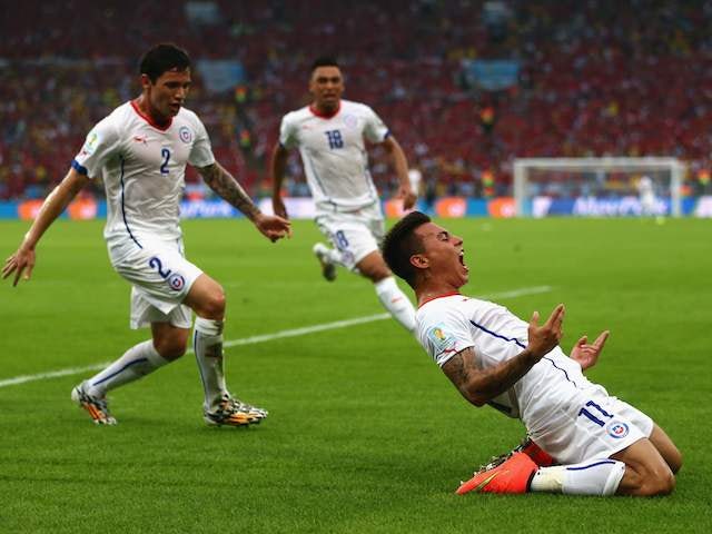 Eduardo Vargas celebrates scoring Chile's first goal against Spain on June 18, 2014.