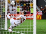 John Terry of England clears an effort from Marko Devic of Ukraine off the line during the UEFA EURO 2012 group D match between England and Ukraine at Donbass Arena on June 19, 2012