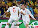 English forward Wayne Rooney and English defender John Terry celebrate after scoring during the Euro 2012 football championships match England vs Ukraine on June 19, 2012