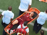 Portugal's Fabio Coentrao is stretchered off during his team's World Cup opener against Germany on June 16, 2014.