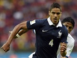France's defender Raphael Varane runs with the ball during a Group E football match between France and Honduras at the Beira-Rio Stadium in Porto Alegre during the 2014 FIFA World Cup on June 15, 2014