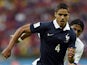 France's defender Raphael Varane runs with the ball during a Group E football match between France and Honduras at the Beira-Rio Stadium in Porto Alegre during the 2014 FIFA World Cup on June 15, 2014