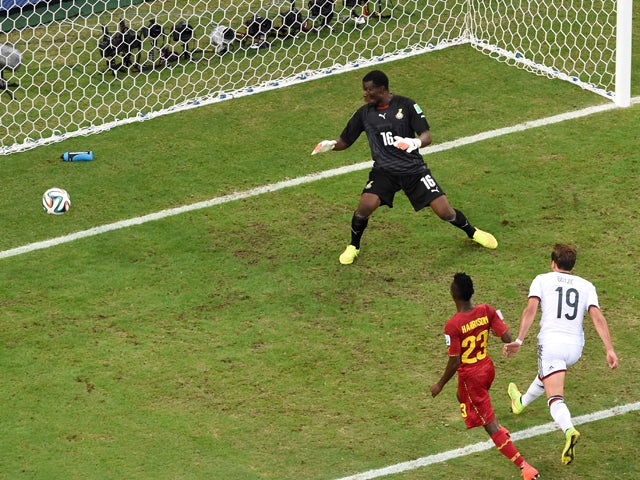 Mario Gotze of Germany scores his team's first goal past goalkeeper Fatawu Dauda of Ghana during the 2014 FIFA World Cup Brazil Group G match between Germany and Ghana at Castelao on June 21, 2014
