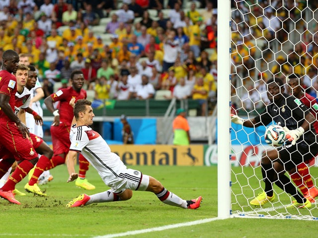 Miroslav Klose of Germany scores his team's second goal past Fatawu Dauda of Ghana during the 2014 FIFA World Cup Brazil Group G match between Germany and Ghana at Castelao on June 21, 2014 