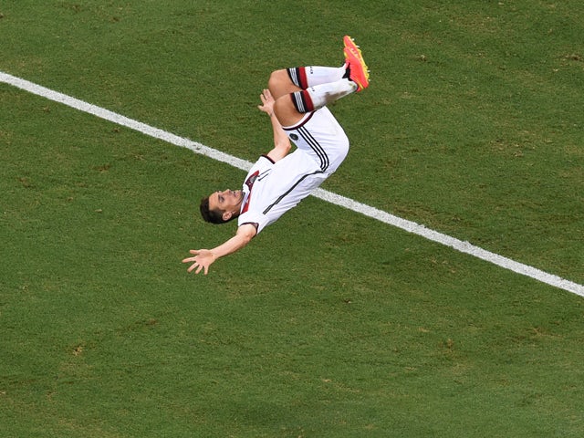 Miroslav Klose of Germany does a flip in celebration of scoring his team's second goal during the 2014 FIFA World Cup Brazil Group G match between Germany and Ghana at Castelao on June 21, 2014
