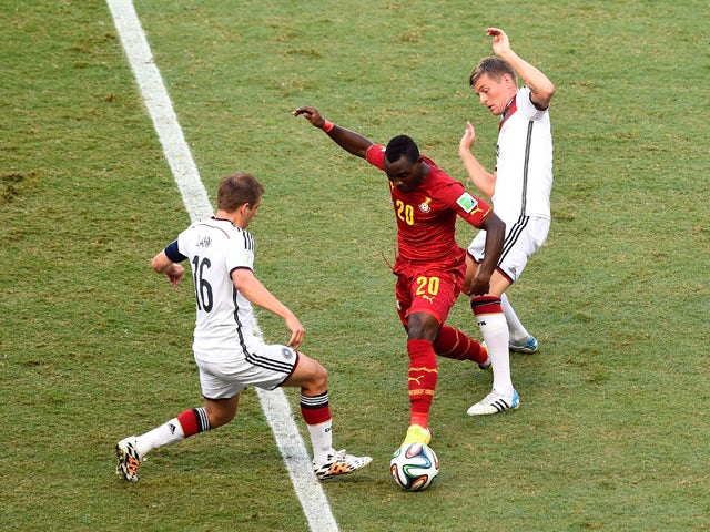 Kwadwo Asamoah of Ghana and Philipp Lahm of Germany compete for the ball during the 2014 FIFA World Cup Brazil Group G match between Germany and Ghana at Castelao on June 21, 2014
