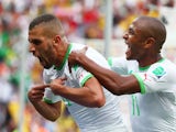 Islam Slimani of Algeria (L) celebrates scoring his team's first goal during the 2014 FIFA World Cup Brazil Group H match against South Korea on June 22, 2014