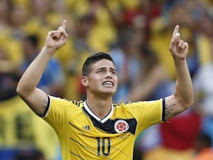 Colombia's midfielder James Rodriguez celebrates scoring during a Group C football match between Colombia and Ivory Coast on June 19, 2014