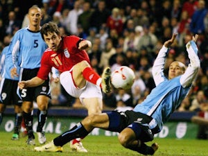 Joe Cole, in action for England, shoots for goal against Uruguay on March 01, 2006.