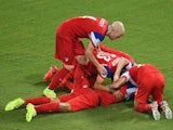 John Brooks of the United States (C) celebrates scoring his team's second goal with Graham Zusi (L) and Fabian Johnson (R) during the 2014 FIFA World Cup match on June 17, 2014