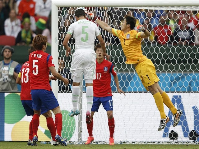 Algeria's defender Rafik Halliche scores in the nets of South Korea's goalkeeper Jung Sung-Ryong during a Group H football match on June 22, 2014