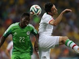 Nigeria's defender Kenneth Omeruo (L) fights for the ball with Iran's midfielder and captain Javad Nekounam during a Group F football match 