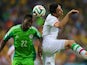 Nigeria's defender Kenneth Omeruo (L) fights for the ball with Iran's midfielder and captain Javad Nekounam during a Group F football match 