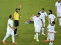 Greece's midfielder Kostas Katsouranis (5th R) is given the red card following a foul on Japan's midfielder Makoto Hasebe during a Group C match on June 20, 2014