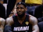 A dejected LeBron James of the Miami Heat looks on from the bench as the San Antonio Spurs win the NBA title on June 15, 2014