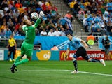 Luis Suarez of Uruguay scores his team's first goal past Joe Hart of England during the 2014 FIFA World Cup Brazil Group D match on June 19, 2014