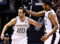 Manu Ginobili (L) and Tim Duncan of the San Antonio Spurs celebrate during game five of the NBA Finals against the Miami Heat at the AT&T Center on June 15, 2014