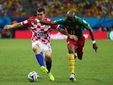 Mateo Kovacic of Croatia controls the ball against Stephane Mbia of Cameroon during the 2014 FIFA World Cup Brazil Group A match on June 19, 2014