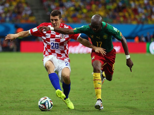 Mateo Kovacic of Croatia controls the ball against Stephane Mbia of Cameroon during the 2014 FIFA World Cup Brazil Group A match on June 19, 2014