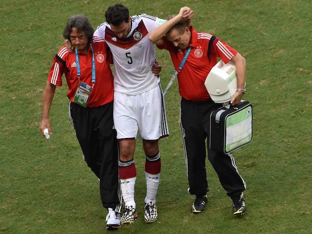 Mats Hummels is taken off injured during Germany's 4-0 victory over Portugal on June 16, 2014.