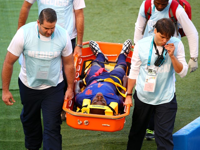Bruno Martins Indi of the Netherlands is stretchered off the field during the 2014 FIFA World Cup Brazil Group B match between Australia and Netherlands at Estadio Beira-Rio on June 18, 2014