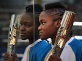 Olympic boxer Nicola Adams holds the Queen's Baton at Burmantofts Amateur Boxing Club on June 12, 201