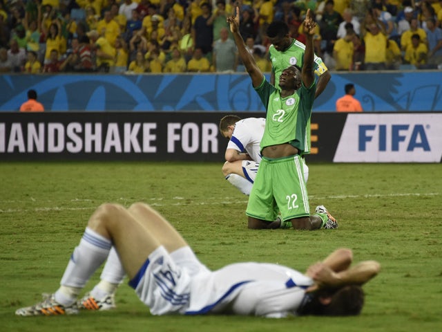 Nigeria's defender Kenneth Omeruo celebrates after winning the Group F football match between Nigeria and Bosnia-Hercegovina at the Pantanal Arena in Cuiaba during the 2014 FIFA World Cup on June 21, 2014