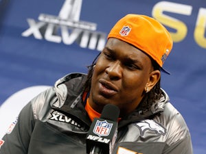  Tackle Orlando Franklin #74 of the Denver Broncos talks to the media during Super Bowl XLVIII Media Day at the Prudential Center on January 28, 2014