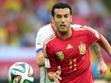 Spain's forward Pedro Rodriguez dribbles the ball during a Group B football match between Spain and Chile in the Maracana Stadium in Rio de Janeiro during the 2014 FIFA World Cup on June 18, 2014