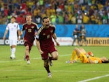 Aleksandr Kerzhakov of Russia celebrates scoring his team's first goal during the 2014 FIFA World Cup Brazil Group H match between Russia and South Korea at Arena Pantanal on June 17, 2014