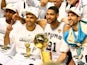 Kawhi Leonard, Tony Parker, Tim Duncan and Manu Ginobili of the San Antonio Spurs celebrate with the Larry O'Brien trophy after winning the NBA title on June 15, 2014