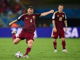 Russia's defender and captain Sergey Ignashevich kicks the ball during a Group H football match between Russia and South Korea in the Pantanal Arena in Cuiaba during the 2014 FIFA World Cup on June 17, 2014