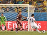 South Korea's forward Lee Keun-Ho scores the 0-1 goal during the Group H football match between Russia and South Korea in the Pantanal Arena in Cuiaba during the 2014 FIFA World Cup on June 17, 2014