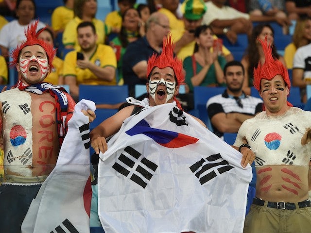 South Korean fans react prior to a Group H football match between Russia and South Korea in the Pantanal Arena in Cuiaba during the 2014 FIFA World Cup on June 17, 2014