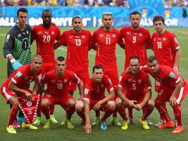 Switzerland players pose for a team photo during the 2014 FIFA World Cup Brazil Group E match between Switzerland and France at Arena Fonte Nova on June 20, 2014