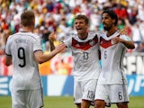 Thomas Muller celebrates scoring his hattrick for Germany in their World Cup opening game against Portugal on June 16, 2014.