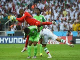 Vincent Enyeama of Nigeria makes a save over teammates Joseph Yobo and Ashkan Dejagah of Iran during the 2014 FIFA World Cup Brazil Group F match on June 16, 2014