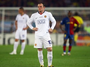 Wayne Rooney looks on dejected after Manchester United concede a goal against Barcelona on May 27, 2009.