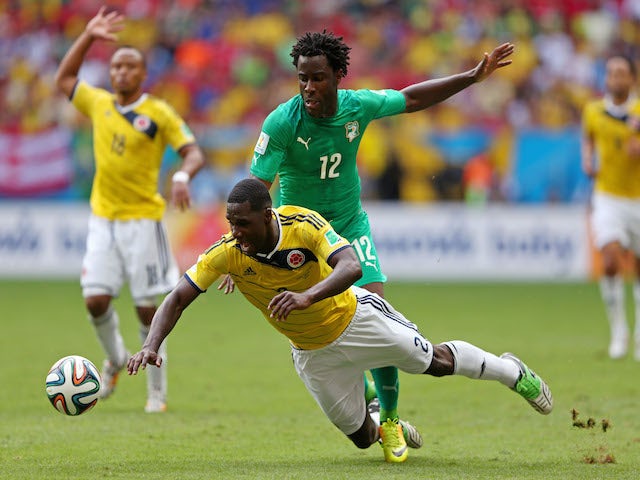 Wilfried Bony of the Ivory Coast and Cristian Zapata of Colombia compete for the ball during the 2014 FIFA World Cup Brazil Group C match on June 19, 2014