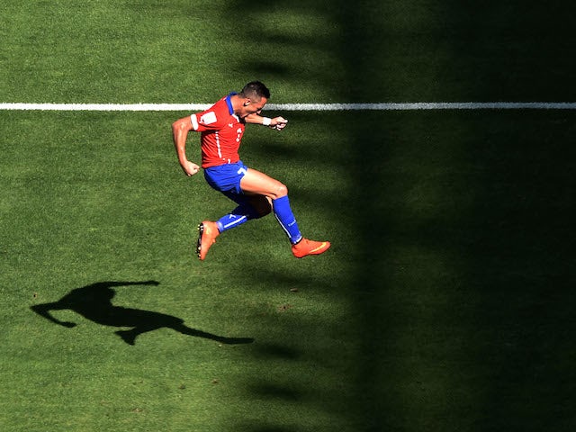 Chile forward Alexis Sanchez celebrates after scoring the equaliser against Brazil in their World Cup last-16 match in Belo Horizonte on June 28, 2014
