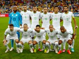 Algeria pose for a team photo prior to the 2014 FIFA World Cup Brazil Group H match between Algeria and Russia at Arena da Baixada on June 26, 2014