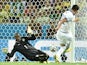 Greece's midfielder Andreas Samaris scores in the nets of Ivory Coast's goalkeeper Boubacar Barry during a Group C football match on June 24, 2014